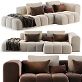 Modern Beige Sectional Sofa With Plush Brown Pillows And Soft Blanket 3d model