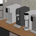 Various Silver Gray Instant Heating Water Dispensers On Wooden Tabletop With Window Blinds Geometric Art