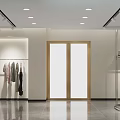 Modern Clothing Store Interior With Clothing Racks Mannequins Seating And Lighting Design