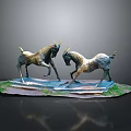 Two Antelope Sculptures In Fighting Stance With Grass Covered Base On Reflective Surface