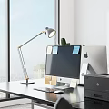 Modern Office Desk Setup With Computer Monitor Desk Lamp Sticky Notes Printer And Potted Plant