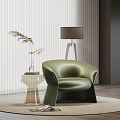 Green Leather Armchair with Transparent Side Table Plant in Vase Floor Lamp on Round Rug