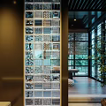 Modern Glass Room Divider With Geometric Patterns And Wooden Frame In Bright Interior Space
