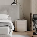 Modern Round Light Wood Nightstand With Books In Bedroom Near Gray Headboard