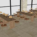 Spacious Indoor Setting With Long Wooden Tables And Chairs Adorned By White Lamps And Large Windows
