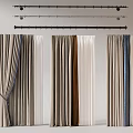 Various Stylish Curtains With Tied Accents And Neutral Striped Colors On Black Rods
