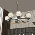 Modern Circular Chandelier With White Spherical Lampshades Black Metal Frame Perforated Wall And Green Plant