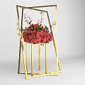 Floral Decor Display in Golden Geometric Frame with Red Flowers and Decorative Branches