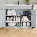Organized Storage Cabinet with Laundry Detergent Powder Plates Cleaning Bottles and Small Boxes