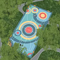 Park Landscape With Colorful Circular Recreational Area Surrounded By Trees And Winding Paths