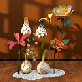 Colorful Floral Display With Orange White Pink Flowers In Spherical Vases On White Pebble Base
