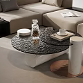 Elegant Black Glass Coffee Table With Cylindrical Legs And Decorative Glassware