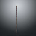 Burning Tall Brown Slim Candle With Flame Against Gray Minimalist Background