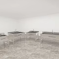 White Interior Room Featuring Four Stainless Steel Sinks On Marble Floor