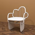 Cloud Shaped Metal Leisure Chair With Gray Padded Seat And Armrests On Wooden Herringbone Floor