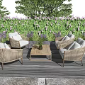Wicker Outdoor Sofa Set With Coffee Table On Wooden Deck In Garden Patio