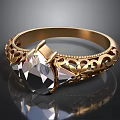 Elegant Gold Ring With Teardrop Gemstone And Intricate Filigree Design