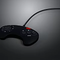 Black Wired Game Controller With Red Action Button And Ergonomic Grip