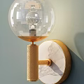 Modern Luxury Wall Lamp with Transparent Spherical Lampshade Gold Textured Column and Marble Decorative Plate