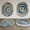 Four Artistic Shaped Rugs With Layered Circular Patterns