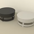 Two Round Black And White Stools With Simple Minimalist Base Design