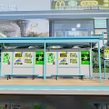 Modern Bus Stop With Blue Roof Advertising Screens And McDonald's Nearby Green Plants Trash Can