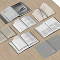 Open Books and Magazines Display on Wooden Table with Various Covers and Pages