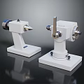 Industrial Equipment Two White Mechanical Units With Metal Shafts And Precision Bases