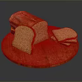 Fresh Brown Bread On Wooden Round Cutting Board With Whole Loaf And Sliced Pieces