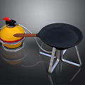Cooking Equipment Set Including Yellow Container Red Lid And Black Frying Pan On Metal Stand