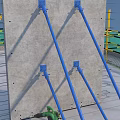 Concrete Slab Structure with Blue Support Poles and Exposed Steel Bars at Construction Site