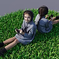 Two Girls in Gray Dresses Sitting Back to Back on Green Grass Holding Black Objects