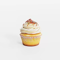 Delicious Cupcake With White Swirl Frosting And Colorful Sprinkles In Yellow Liner