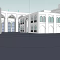 Commercial Street Featuring Traditional White Buildings Arched Windows And Open Courtyard