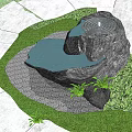 Natural Stone Water Feature Garden Ornament With Pond Surrounding Grass And Green Plants