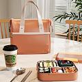Orange Leather Lunch Bag With Starbucks Coffee Cup And Bento Box On Table