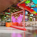 Cyberpunk Style Restaurant Interior with Neon Lights Dining Tables Chairs Green Plants and Decorative Paintings