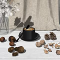 Cup of Coffee with Walnuts Pine Cones and White Flowers on Table with Linen Background