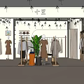 Fashionable Clothing Store Interior With Mannequins Various Apparel And Decorative Plants