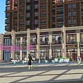 Vibrant Commercial Street With Modern Buildings Shops Outdoor Seating And Pedestrians