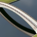 Scenic Arch Bridge With Railing And Reflection Over Calm Water By Green Grass