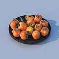 Fresh Ripe Persimmons on Black Plate with Green Leaf Decoration