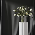 White Tulips in Clear Glass Vase on White Pedestal with Greenery and Dark Curtain