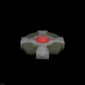 Circular Weapon Device Featuring Green Base Red Sphere And Gray Structural Components 3d model