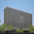 Modern Office Building with Glass Facade and Trees Along Street with Vehicles