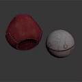 Decorative Red Leather Ball With Stitched Detail And Silver Metal Ball With Round Holes