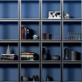 Modern Open Bookcase With Blue Backdrop Multiple Compartments Books And Decorative Vases 3d model