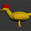 Yellow Duck Toy With Red Hat Orange Beak And Orange Feet On Gray Background