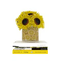 Yellow Sunflowers in Transparent Vase with Lemon Slices against Gray Diamond Wall