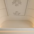 Elegant Ceiling Design With Ornate Carved Patterns Curved Molding And Recessed Lighting